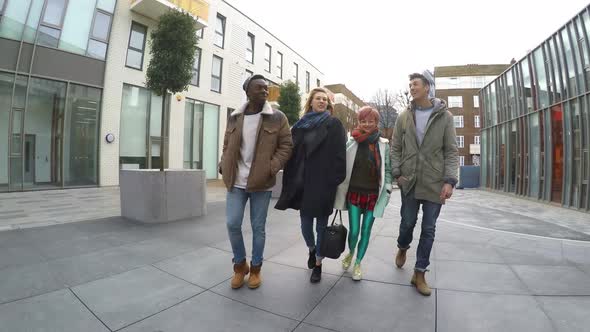 Multiracial group of friends walking in London