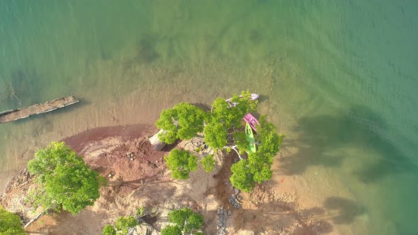 Aerial drone photo of sport canoes with trees as shot from above in lake or pond Amazing top view