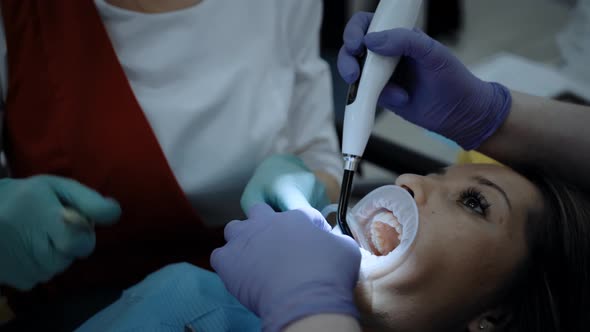 A Dentist at Work with Patient