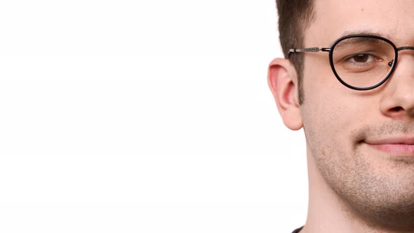 Half Side Portrait of Caucasian Man 20s Wearing Glasses Smiling at Camera While Being Calm and Relax