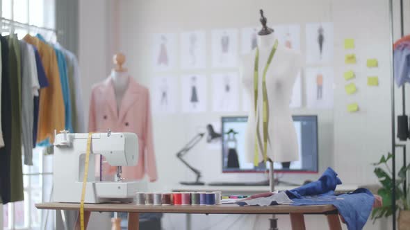 A Mannequin With Tape Measure Is In The Designer Studio