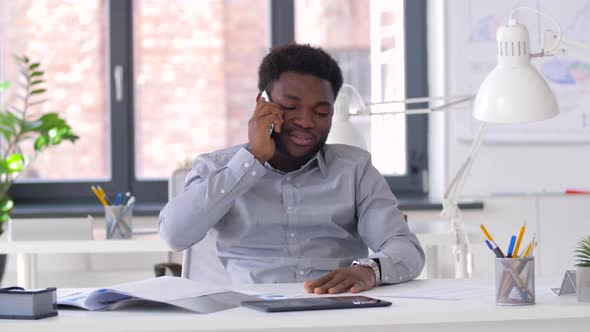 Businessman Calling on Smartphone at Office 
