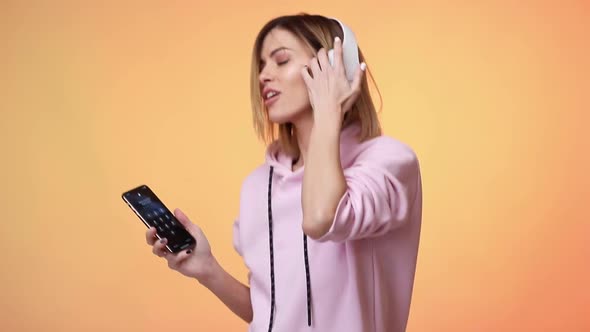 Blonde Woman Dance with Headphones