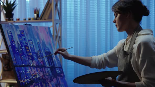 Talented Artist Works on Oil Painting Using a Brush She Draws Modern City with Houses