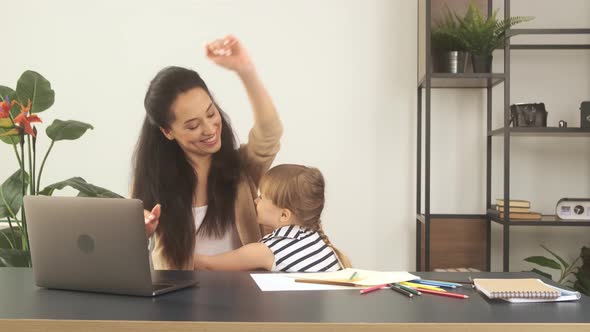 Busy Woman Trying to Work While Babysitting