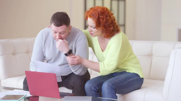 Loving Woman Calming Down Stressed Man Reading Letter