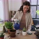 Happy Woman or Blogger Planting Flowers at Home - VideoHive Item for Sale