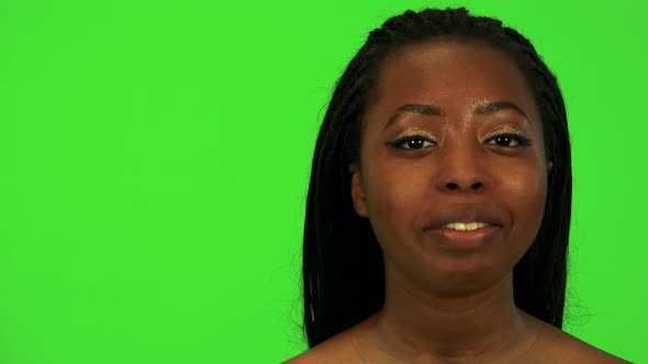 A Young Black Woman Talks To the Camera - Face Closeup - Green Screen Studio