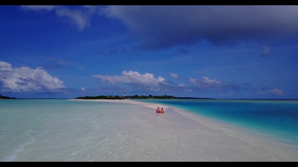 Boy and girl tan on paradise coastline beach time by blue green sea and white sand background of the