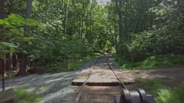 A Ride in the Cab View, of An Antique Steam Engine, Riding Along a Single Track in the Woods on a Su