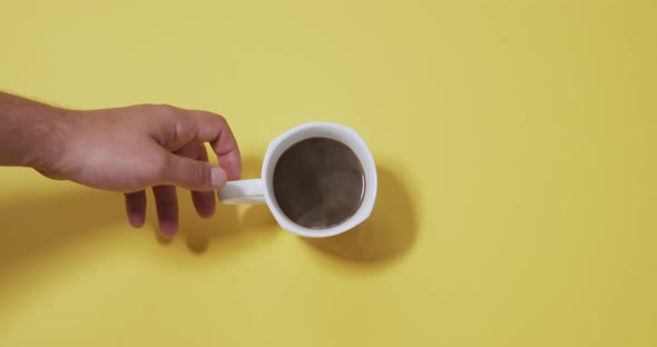 Cup of Coffee on a Yellow Background