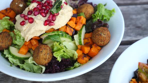 Healthy Eating Concept. Closeup Of Vegan Salads With Falafel, Hummus, Bulgur And Avocado.