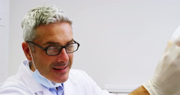 Portrait of smiling dentist in dental clinic