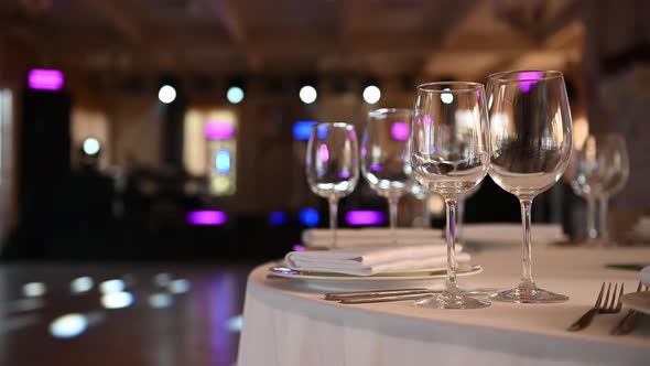 Luxurious Restaurant. Luxurious Interior, White Tables, Serving Dishes and Glasses for Guests