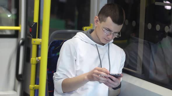 Young Man Drives A Bus