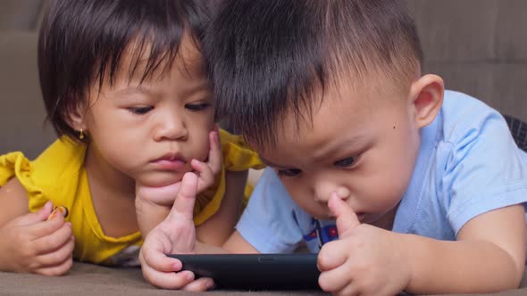 Little Children Playing With Mobile Phone