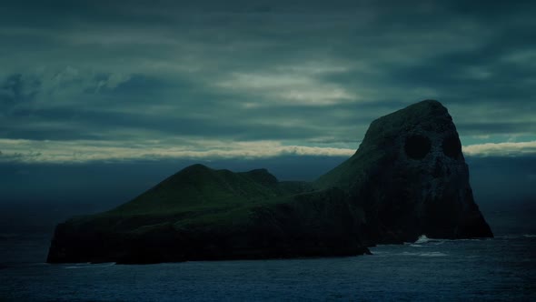 Island With Skull Face On Cliffs