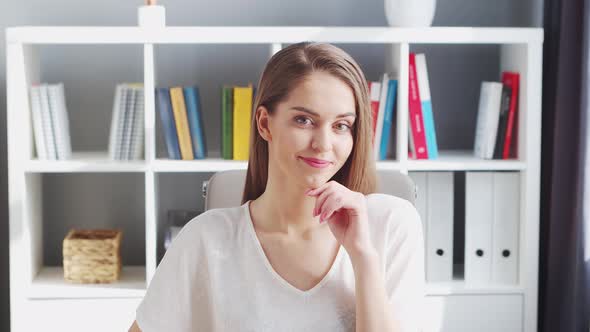 Young Woman Works at Home Office Using Computer.