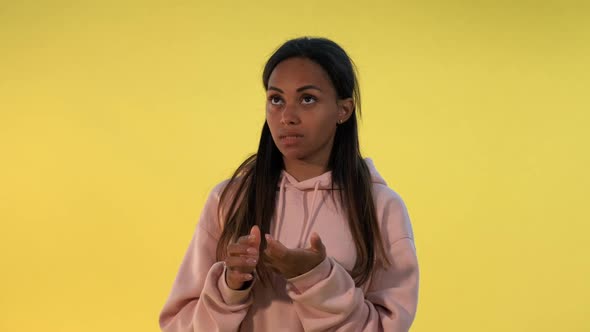 Good-looking Black Woman Counting Something on Fingers