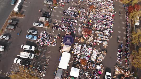 Aerial top-down panning of parking lot distribution center for Camp Fire evacuees in California