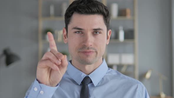 No, Young Man Rejecting Offer By Waving Finger