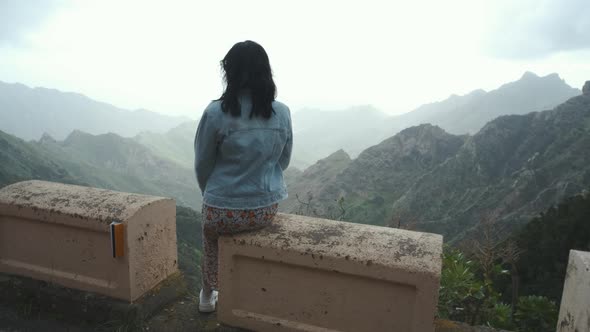 Beautiful Tourist Woman Looking to Mountains Panorama View From Observation Point on Tenerife Island