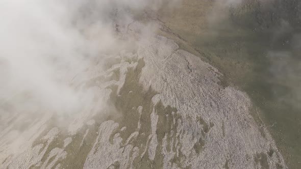 Scenic aerial view of moving white clouds at Abuli Mountain. Georgia