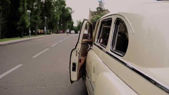 the door of an old vintage classic car opens