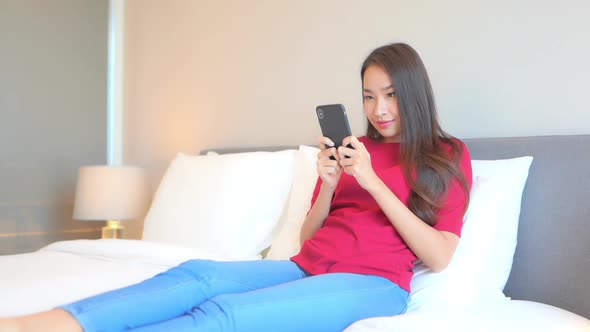 Young asian woman use smart phone