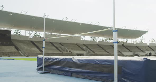 Mixed race athlete doing high jump