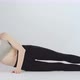 Slender Girl Does Exercises Lying on Her Side and Lifting Her Leg Up - VideoHive Item for Sale