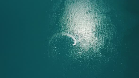 Aerial View From Above on Calm Azure Sea and Volcanic Rocky Shores