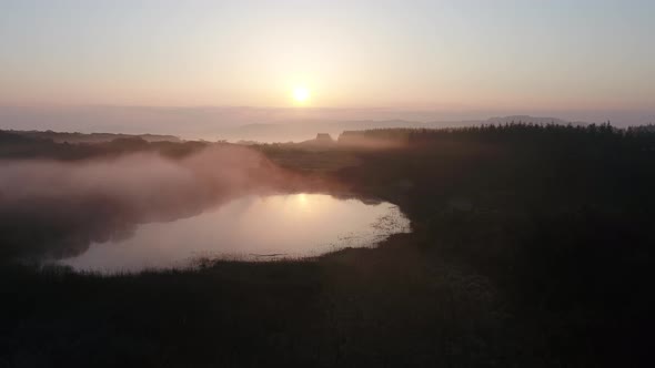 Beautiful Sunrise Above Peatbog in County Donegal with Fog  Ireland