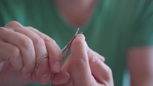 Man Grinds His Nails and Does a Manicure