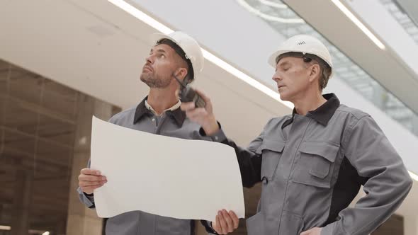 Caucasian Builders Preparing to Work