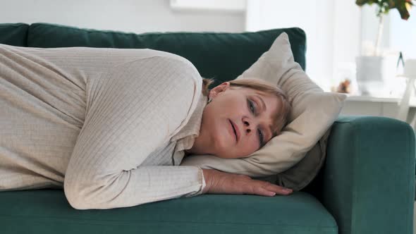 Tired Exhausted Mature Woman Falls Down On Soft Sofa Cushions Falling Asleep