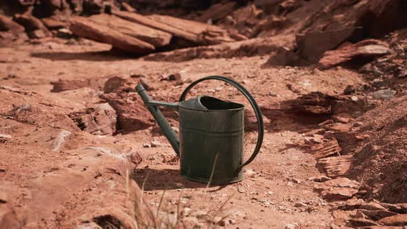 Beverage Can in Sand and Rocks Desert