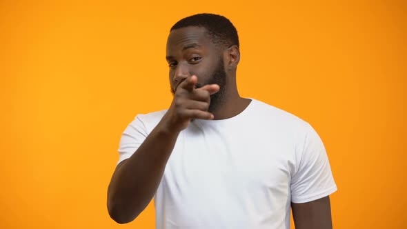 Cheerful Afro-American Man Showing Call Me Gesture, Getting Acquainted on Party