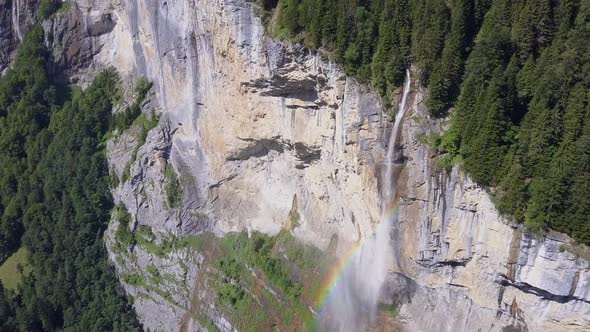 Aerial travel drone view of the Lauterbrunnen Valley and Staubbach Falls, Switzerland.