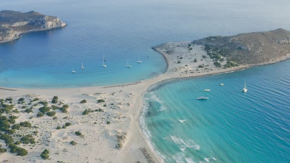 Aerial flying over Elafonisos Greek island, Simos double sandy beach