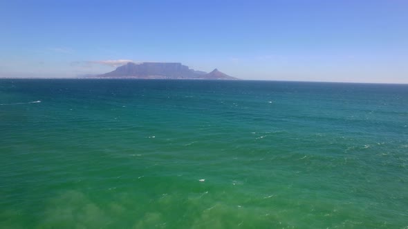 Aerial travel drone view of Table Mountain, Table Bay from Bloubergstrand, Cape Town, South Africa.