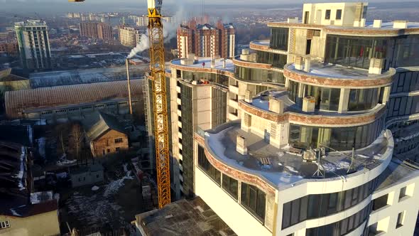 Aerial View of High Modern Residential Building and Tower Crane Under Construction