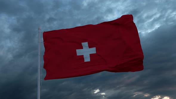 Realistic Flag of Switzerland Waving in the Wind Against Deep Heavy Stormy Sky