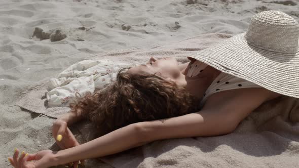 Hot Woman Enjoy Sunlight Covering Body Wide Brimmed Hat on Seashore Close Up