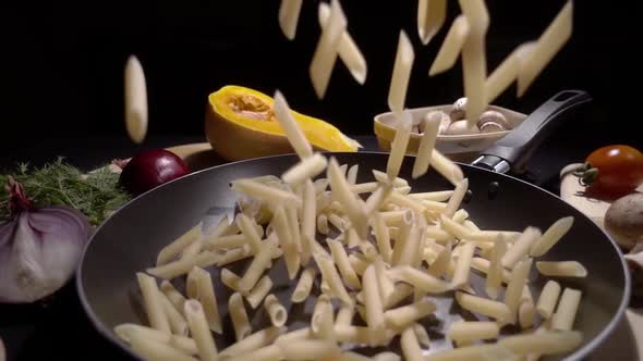 Pasta Flying in the Air on a Black Background in Slow Motion