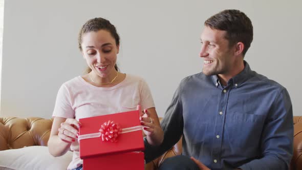 Happy young caucasian couple in love spending valentines day at home