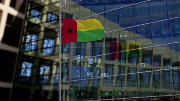 Guinea Biisau Flag Waving On A Skyscraper Building