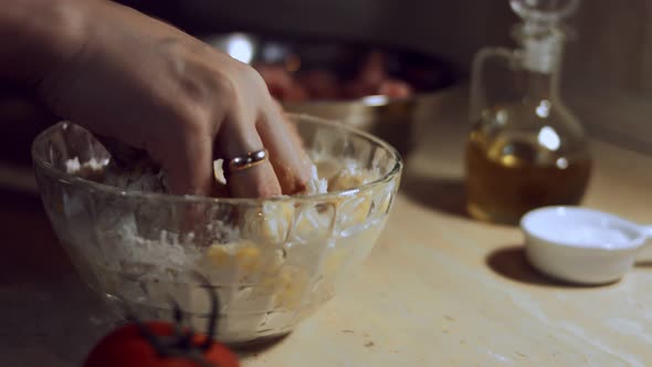 Closeup Female Hand Mixing Food Ingredients in Glass Bowl