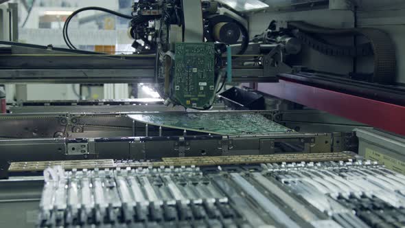 Surface Mount Technology SMT Machine places components on a circuit board