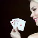 Young woman holding hand on cards and winking - VideoHive Item for Sale